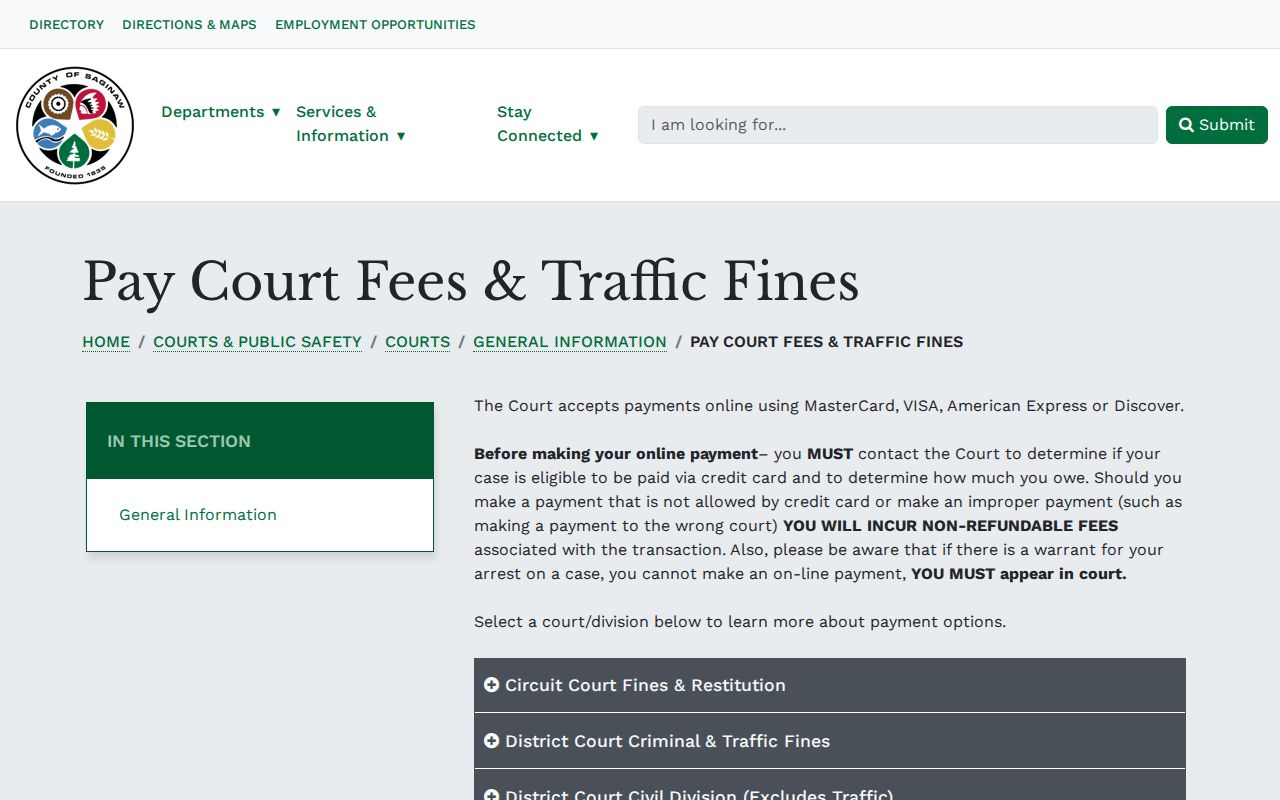 Saginaw County court payment page with the traffic warrant payment warning